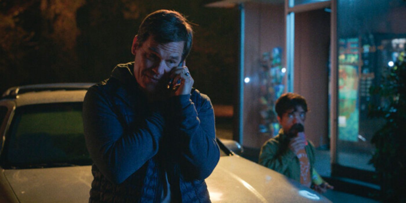 Josh Brolin talking on the phone with Peter Dinklage standing behind him in &lsquo;Brothers&rsquo;.