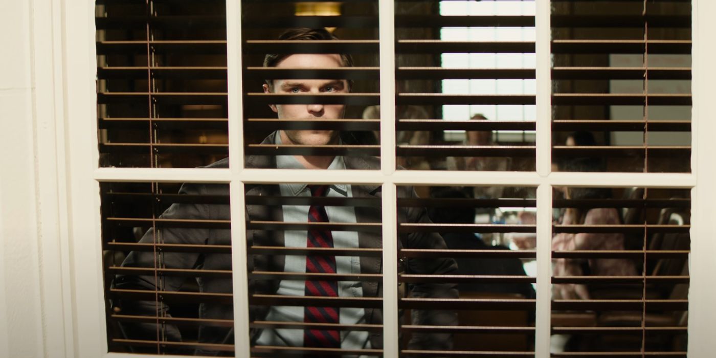 Nicholas Hoult staring out a window in Juror No. 2