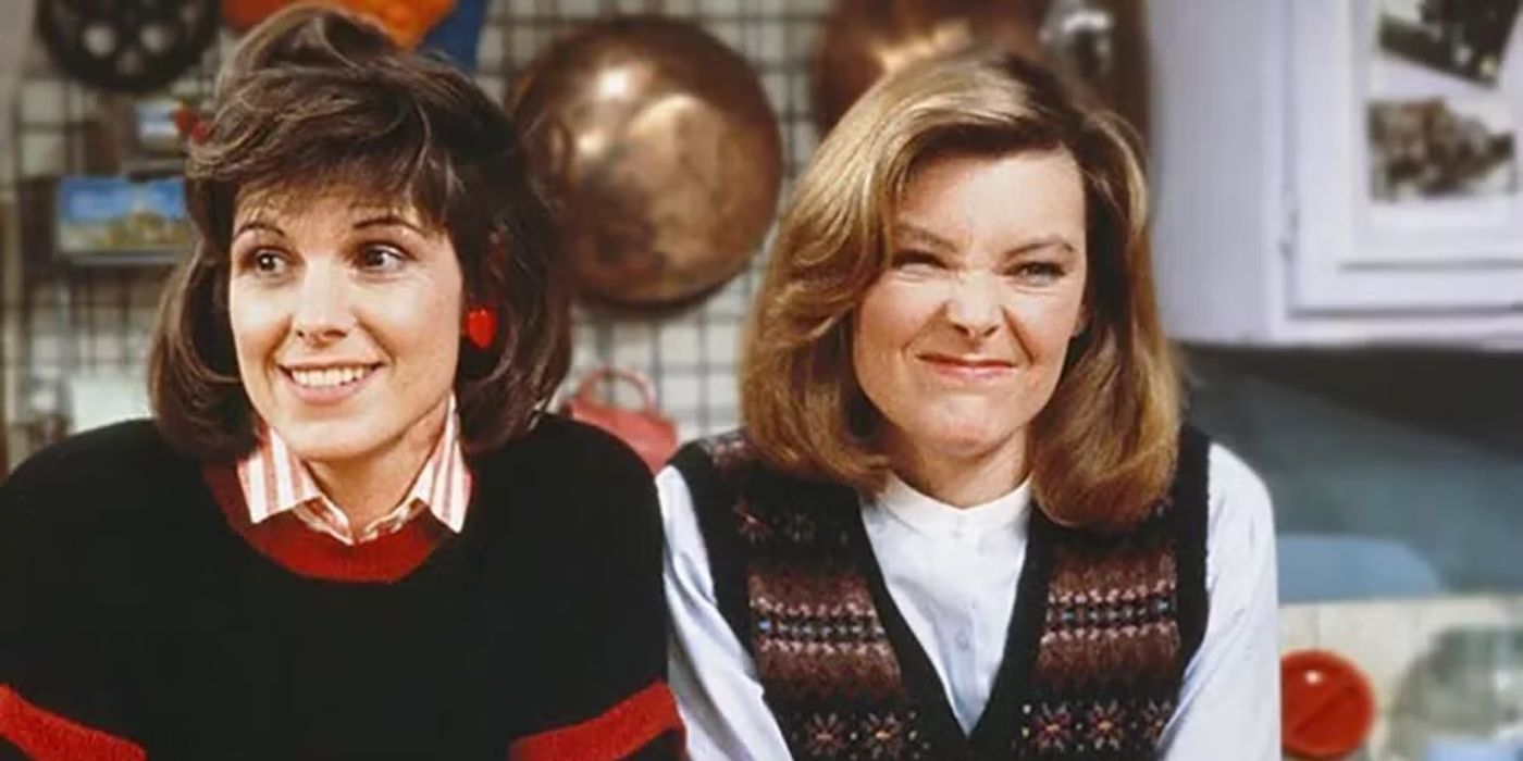 Kate and Allie sitting on a couch looking surprised in Kate & Allie.