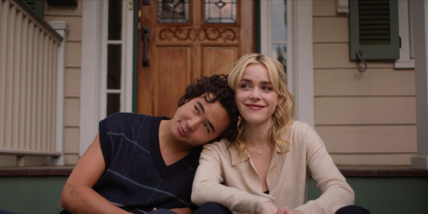 Nico Hiraga sitting next to Kiernan Shipka with his head resting on her shoulder in 'Sweethearts'.