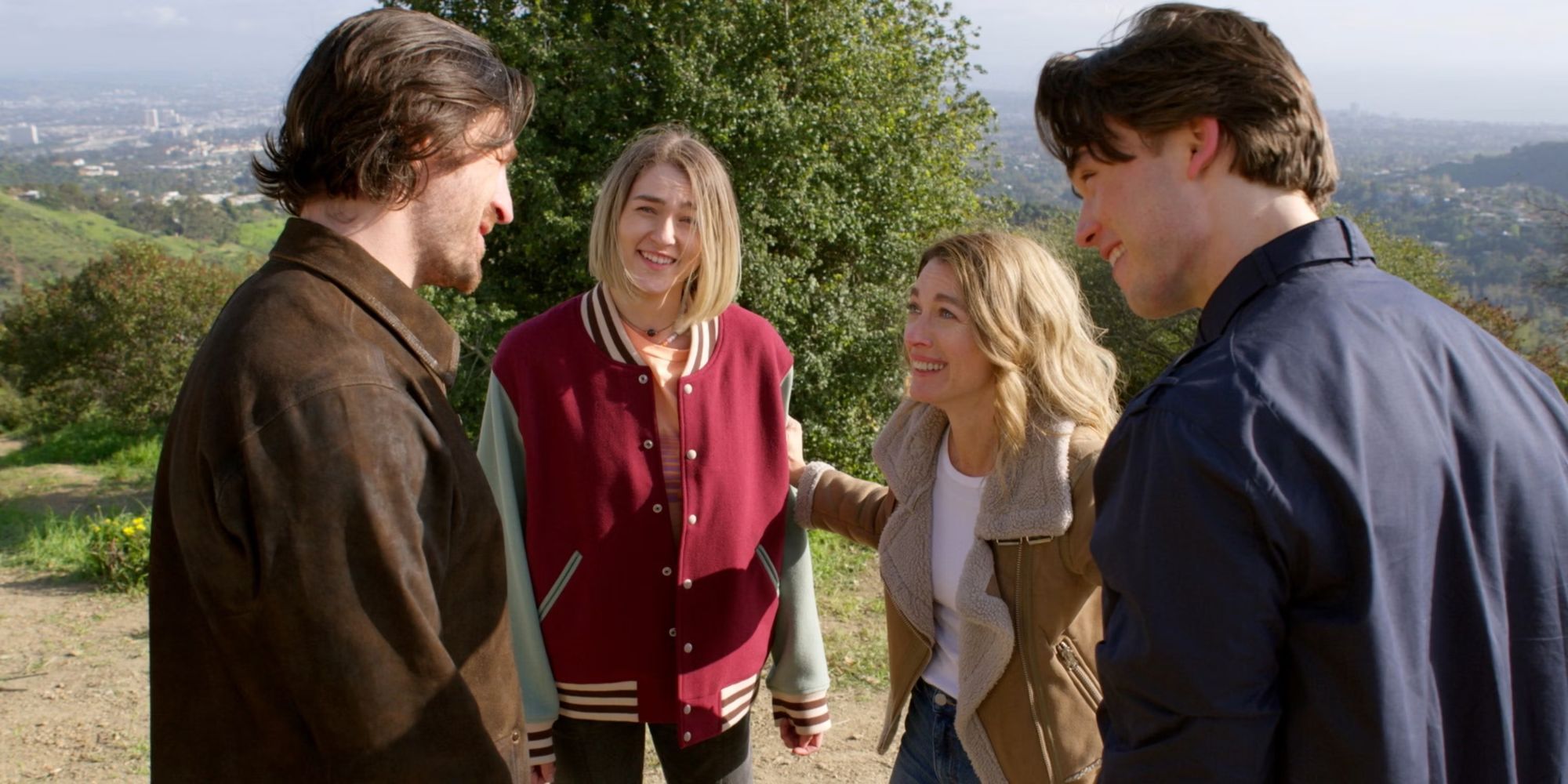 Eoin Macken as Gavin, Natalie Zea as Eve, Zyra Gorecki as Izzy and Jack Martin as Josh stand on a hill in La Brea