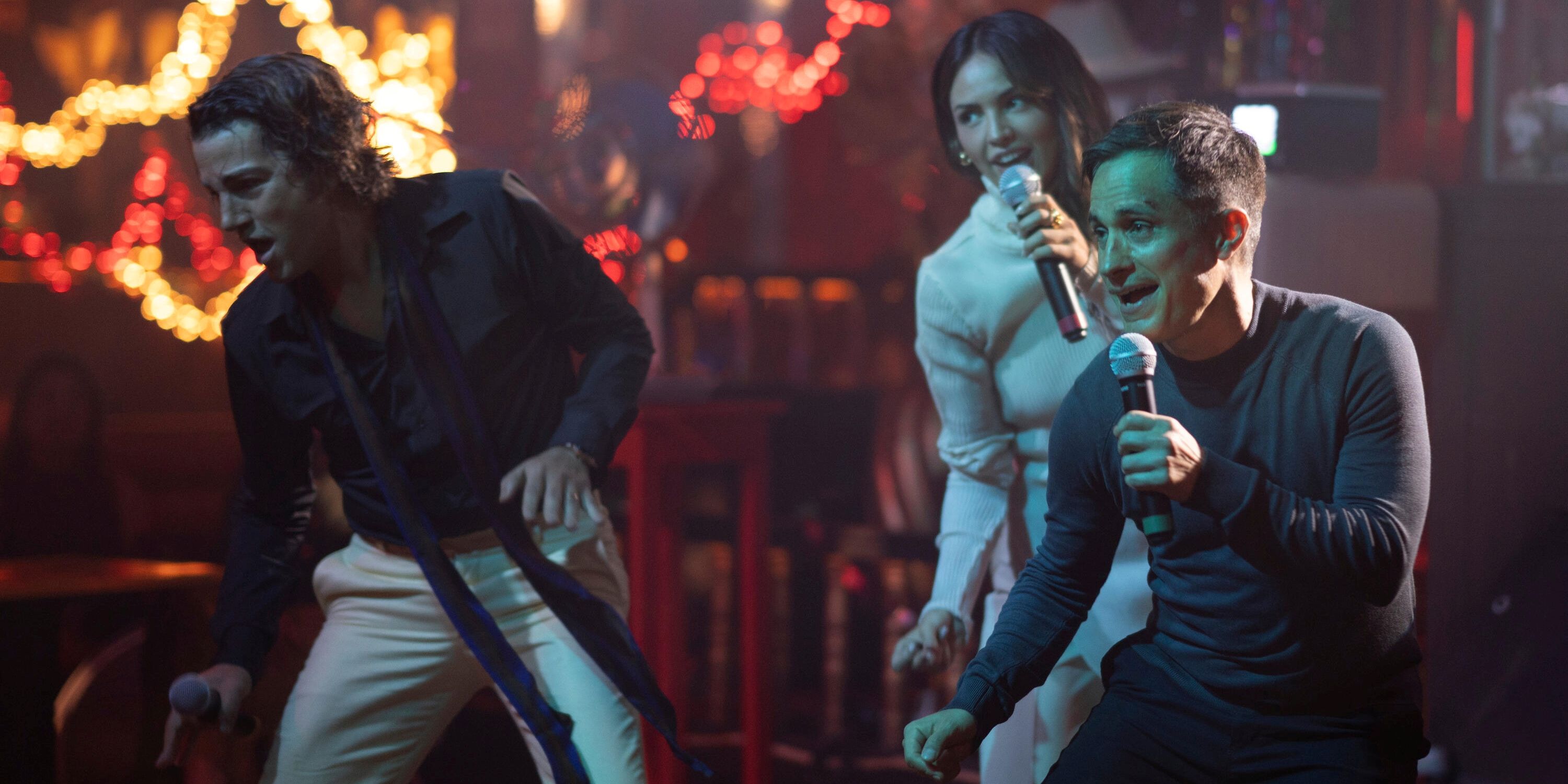 Diego Luna as Andy and Gael Garcia Bernal as Esteban with Eiza Gonzalez doing karaoke in La Maquina