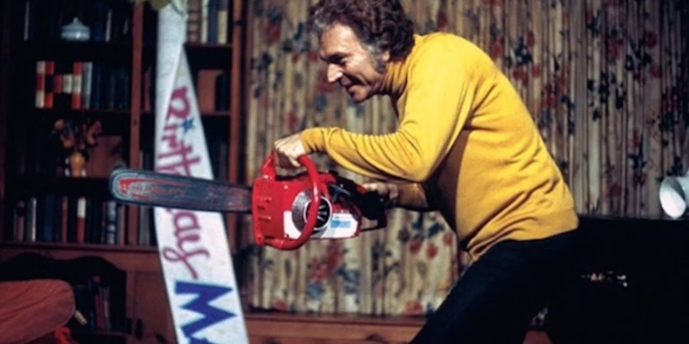 Richard Towers holding a chainsaw in The Last House on the Left 1972.