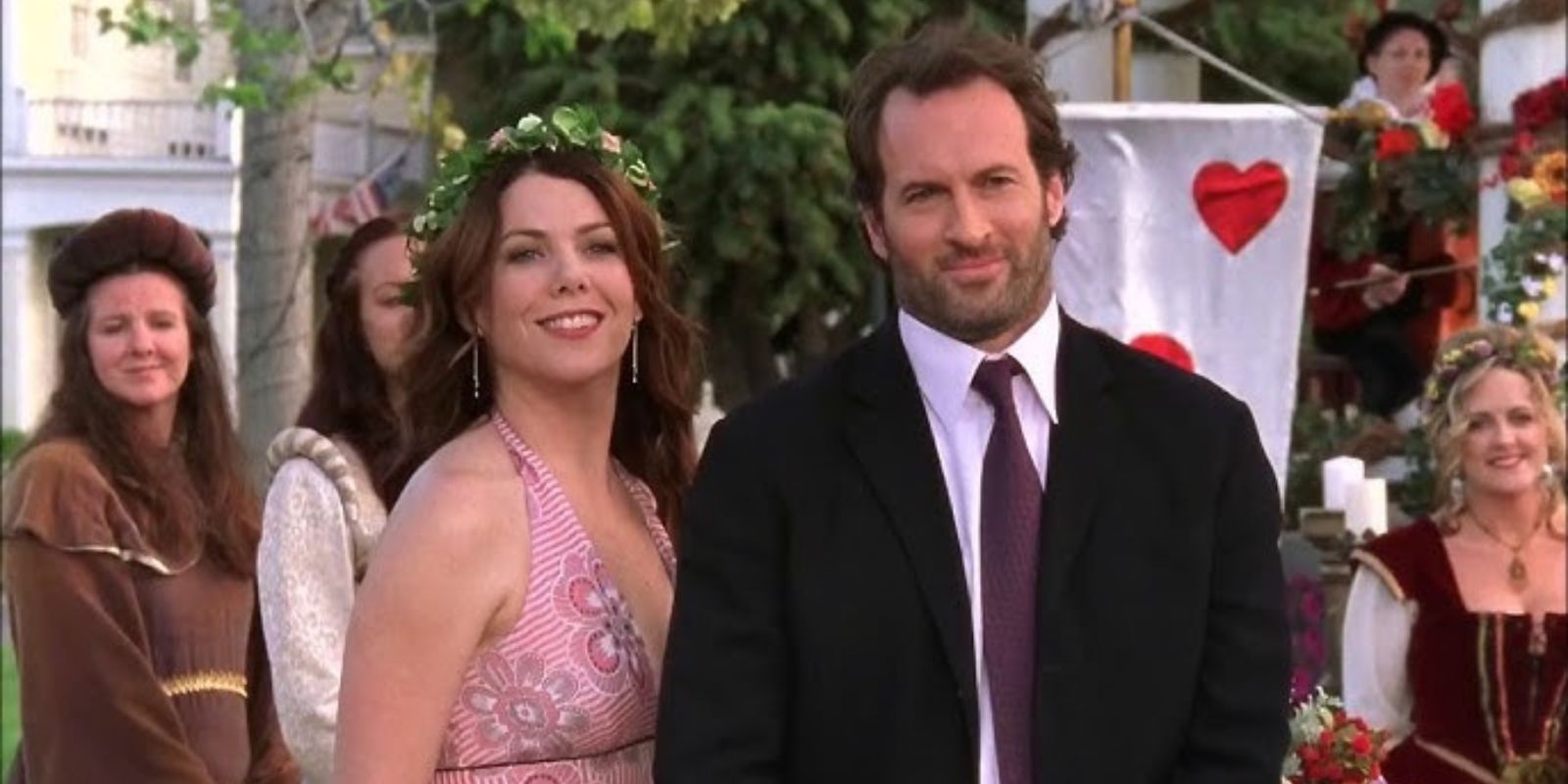 Lorelai and Luke laughing at Liz&rsquo;s wedding in Gilmore Girls 2