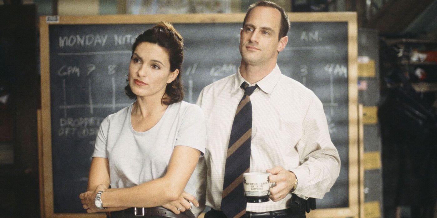 Benson and Stabler stand in front of a chalkboard with a timeline on it in Law and Order: SVU Season 1.?