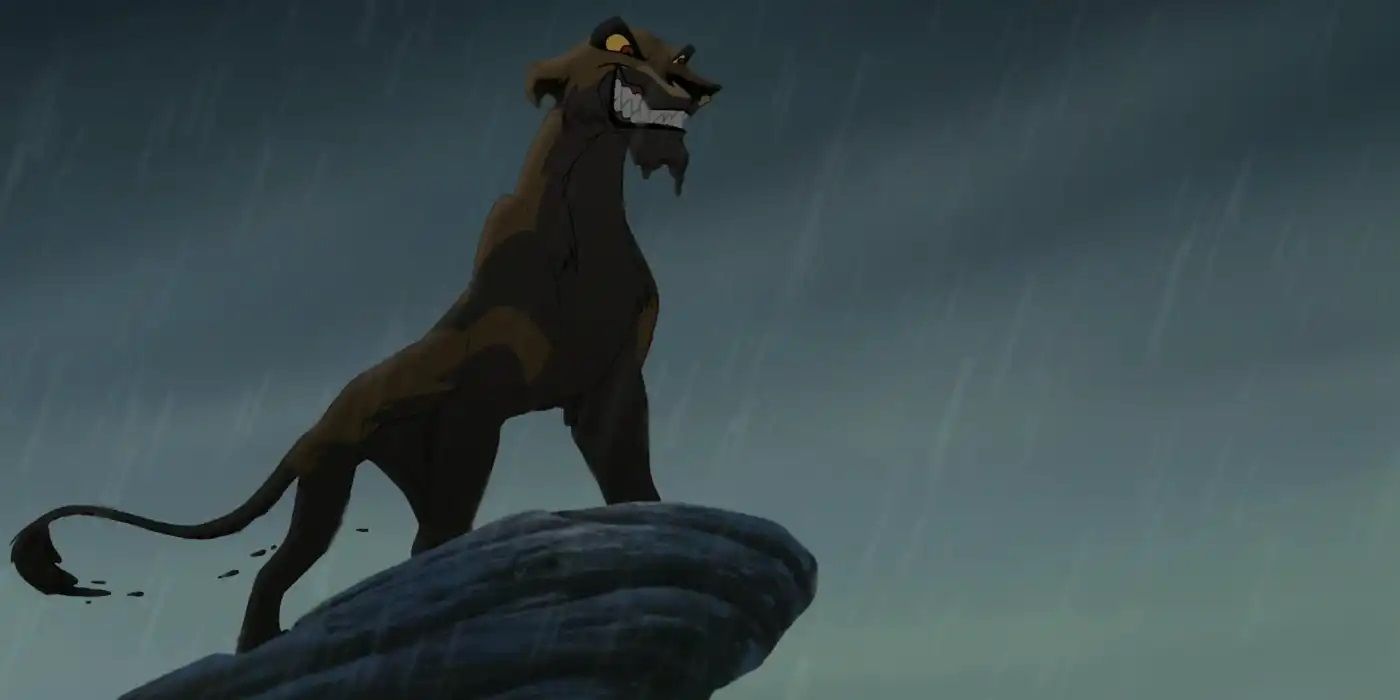 Zira stands on a rock in the rain, covered in mud