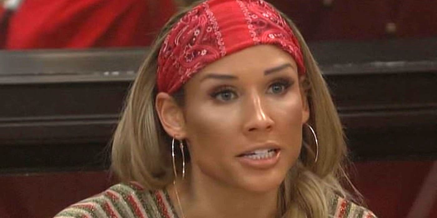 Lolo Jones in a red bandanna talks to someone off camera on Celebrity Big Brother.