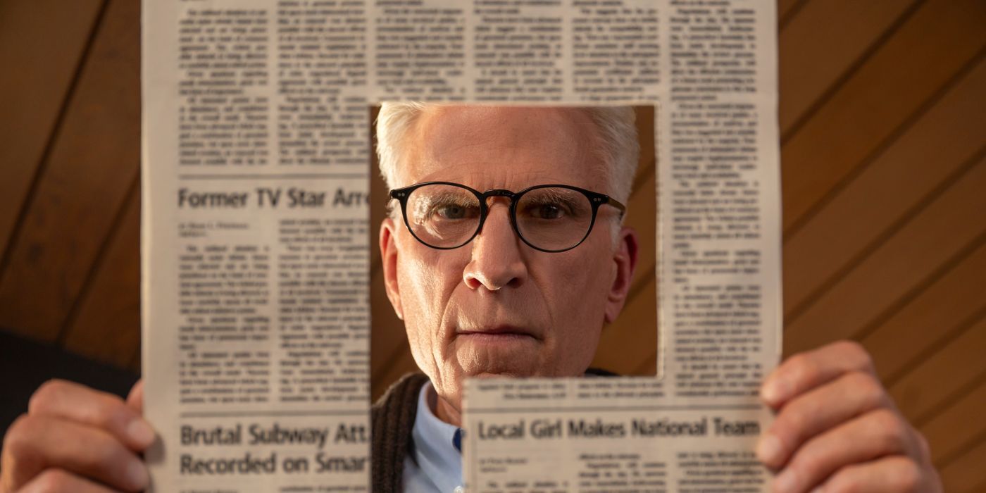 Ted Danson looks through a hole in the newspaper in 'A Man on the Inside'