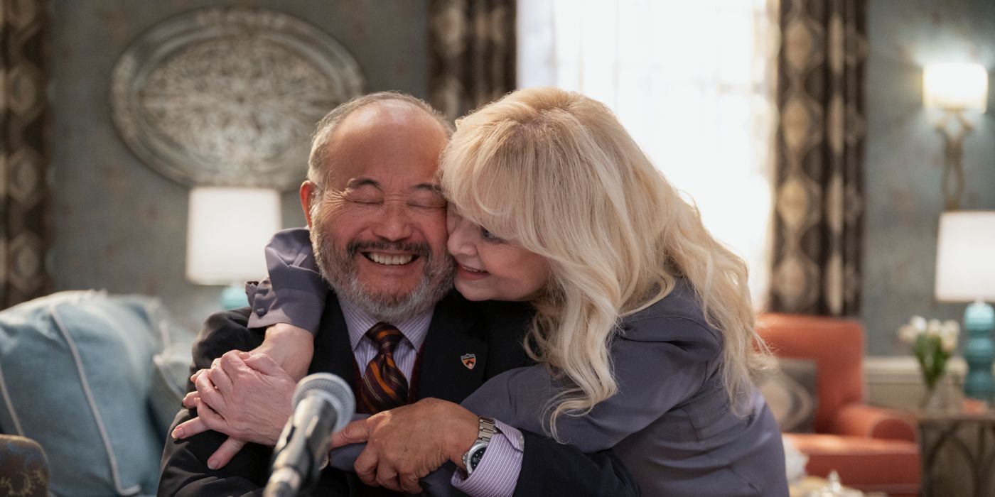 Clyde Kusatsu and Sally Struthers smile while hugging one another in 'A Man on the Inside'