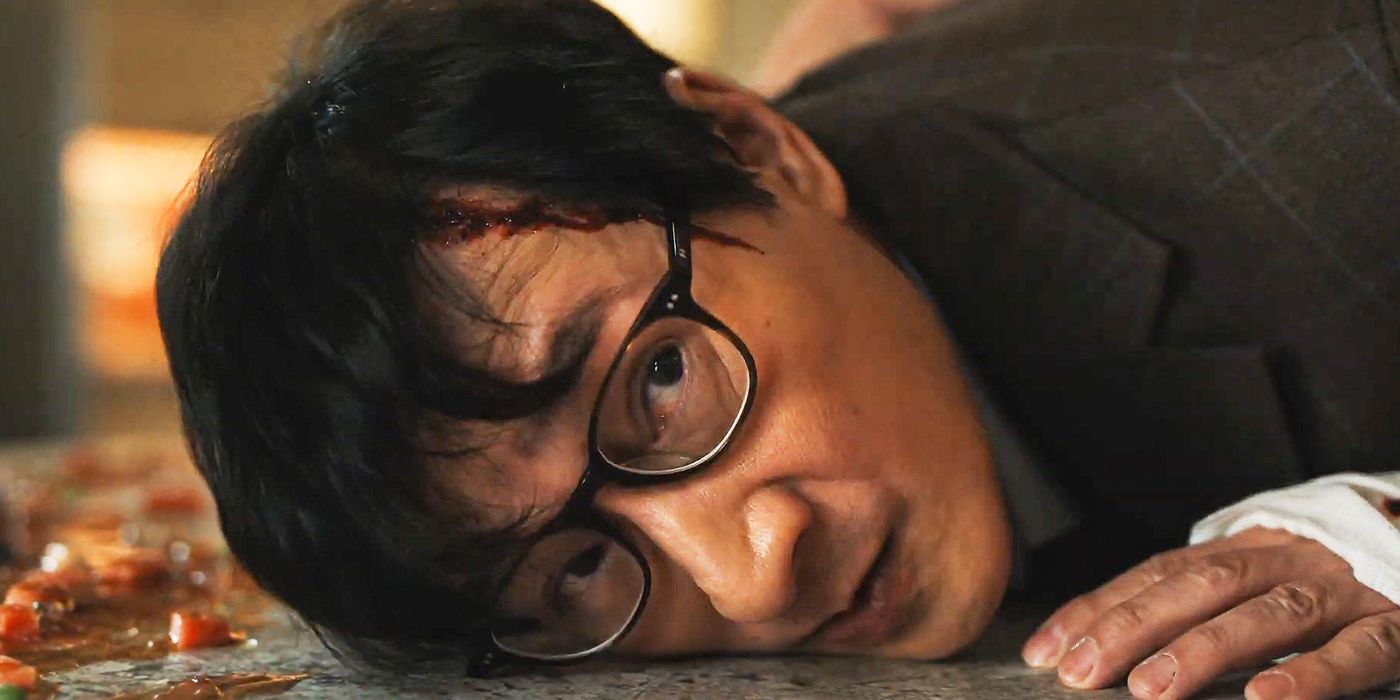 Ke Huy Quan as Marvin Gable laying on the ground with his right cheek down in Love Hurts