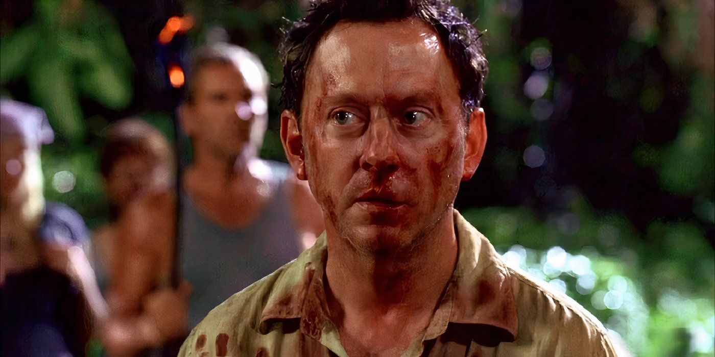 Michael Emerson as Ben Linus has a bloodied face and looks anxious in Lost.