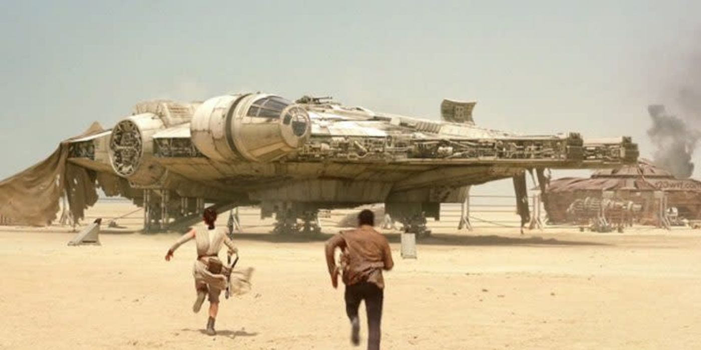 Rey (Daisy Ridley) and Finn (John Boyega) run towards Millennium Falcon in Star Wars: The Force Awakens