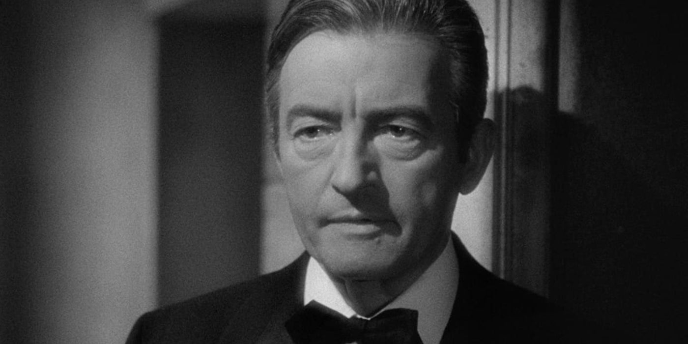 Alexander Sebastian (Claude Rains) stands in a tuxedo, looking almost longingly in 'Notorious' (1946).