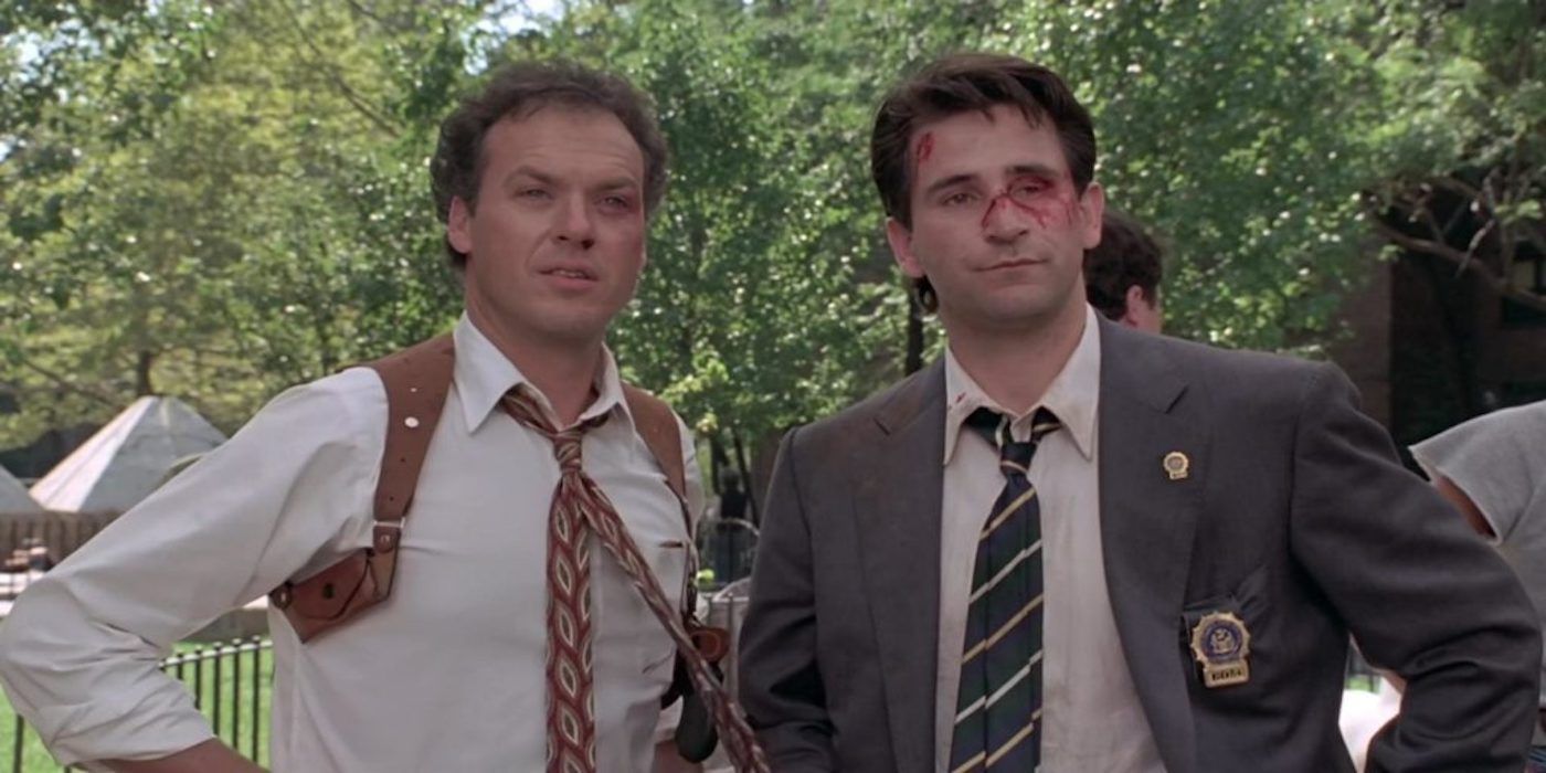 Michael Keaton and Anthony LaPaglia in a park in One Good Cop