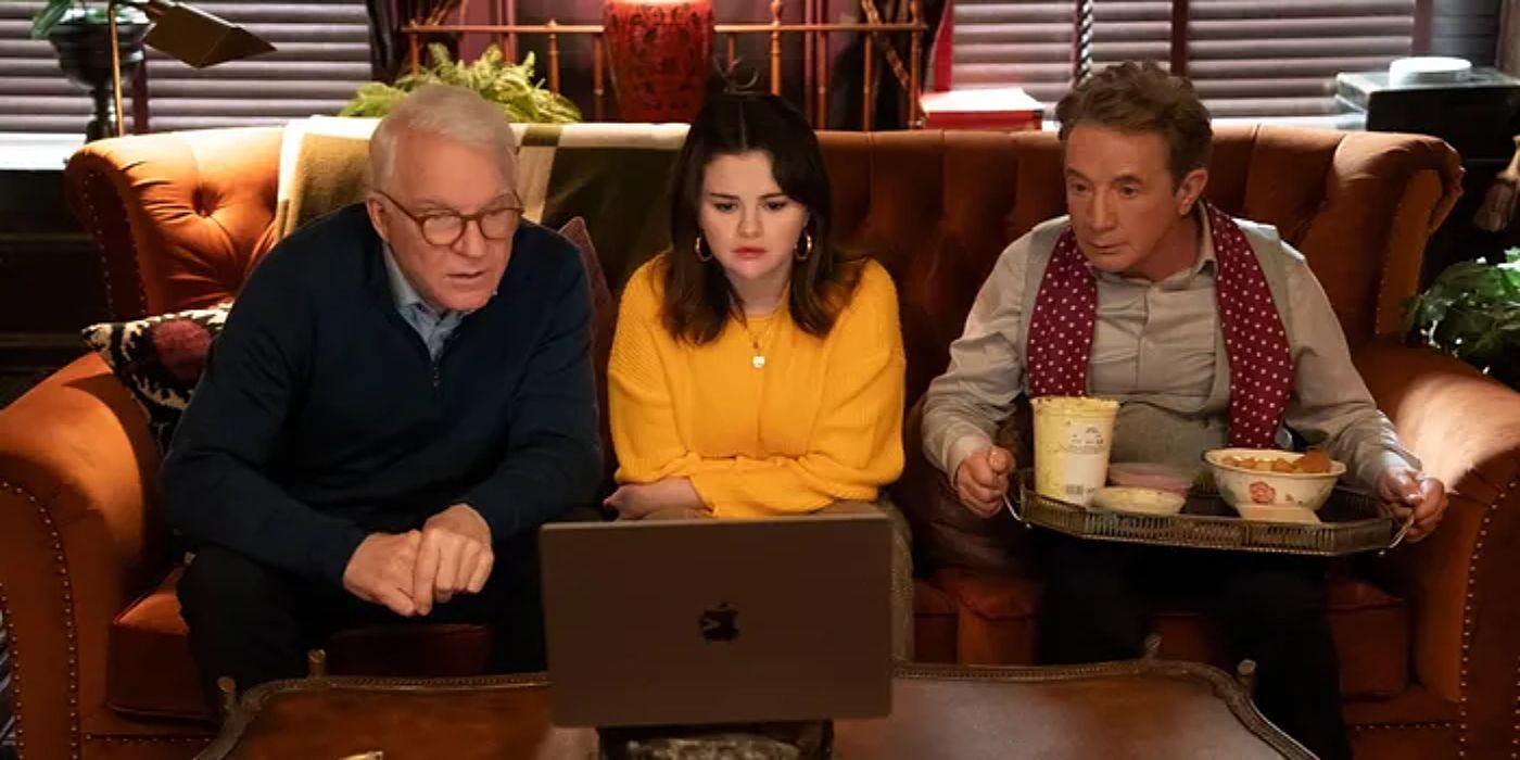 Charles, Mabel, and Oliver watching a short film on a laptop.