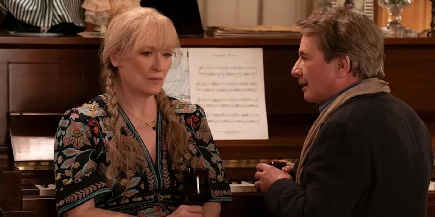 Loretta and Oliver sitting at a piano in Only Murders in the Building. 