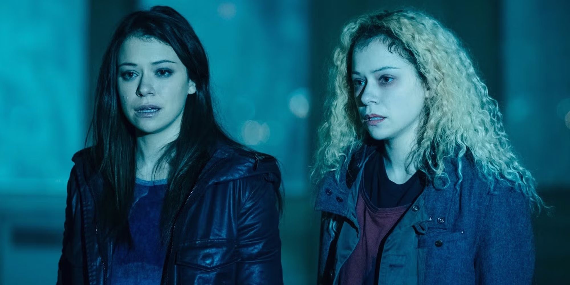 Tatiana Maslany as Sarah and Helena look worried standing in the woods at night in Orphan Black.