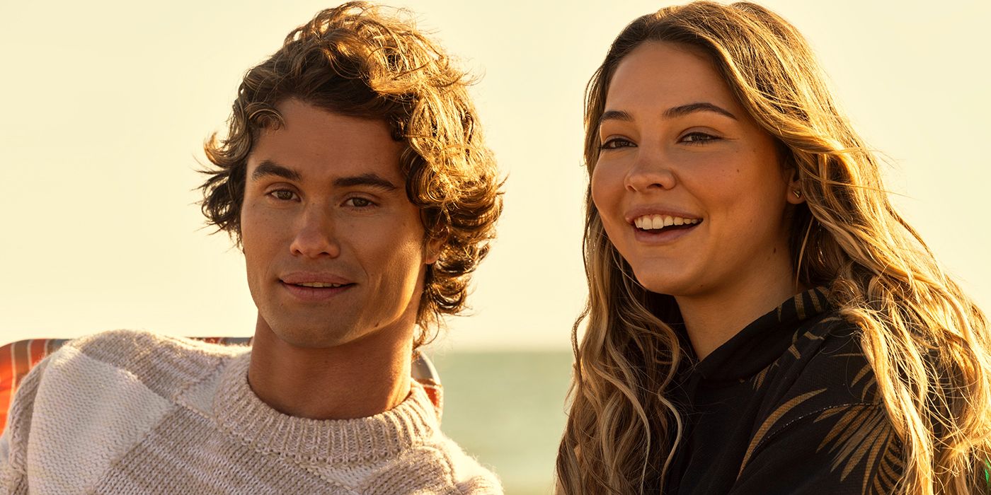 Chase Stokes as John B smiling next to Madelyn Cline as Sarah in Outer Banks Season 4 Part 1