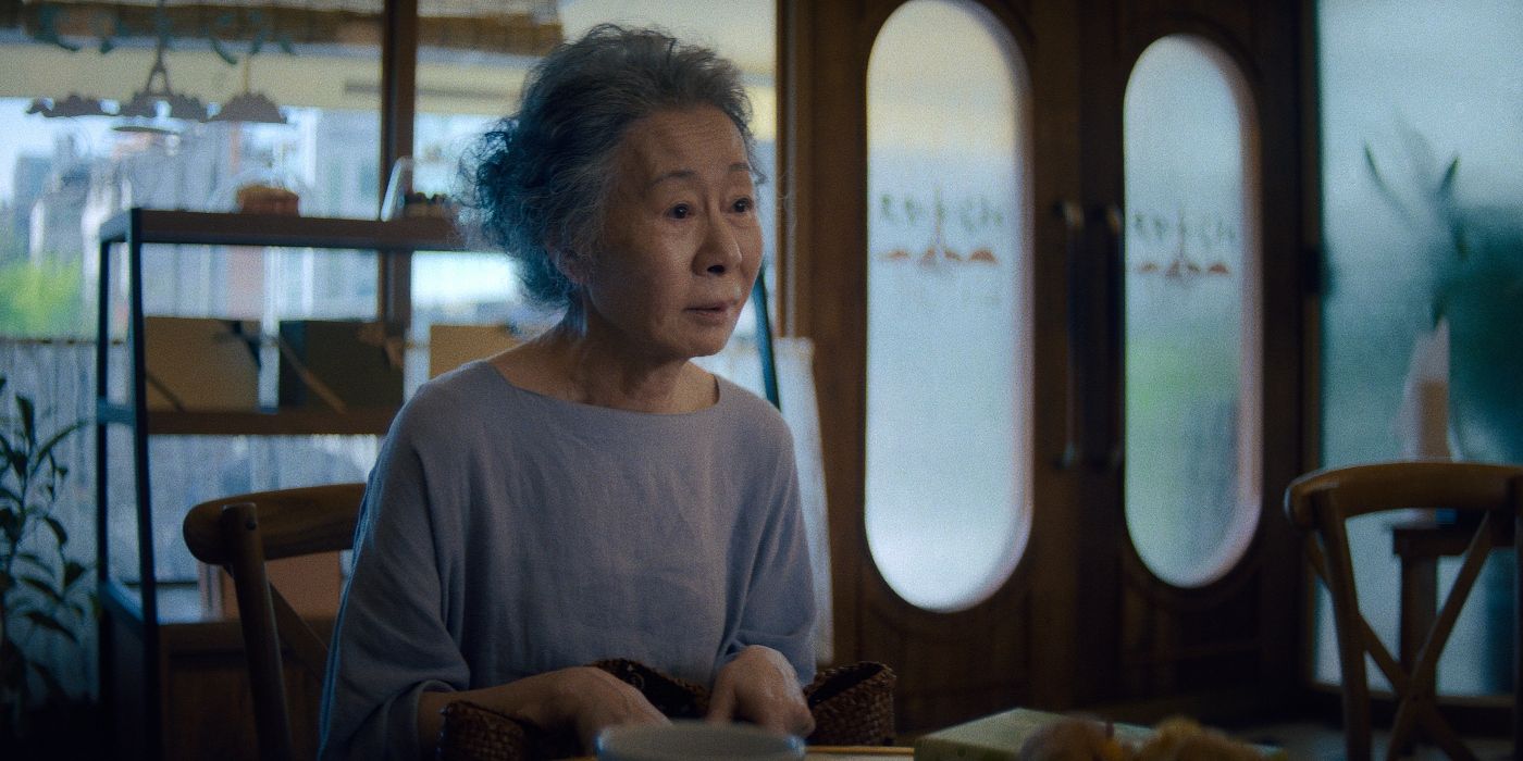 Yuh-Jung Youn sitting in a coffee shop in the Pachinko Season 2 finale