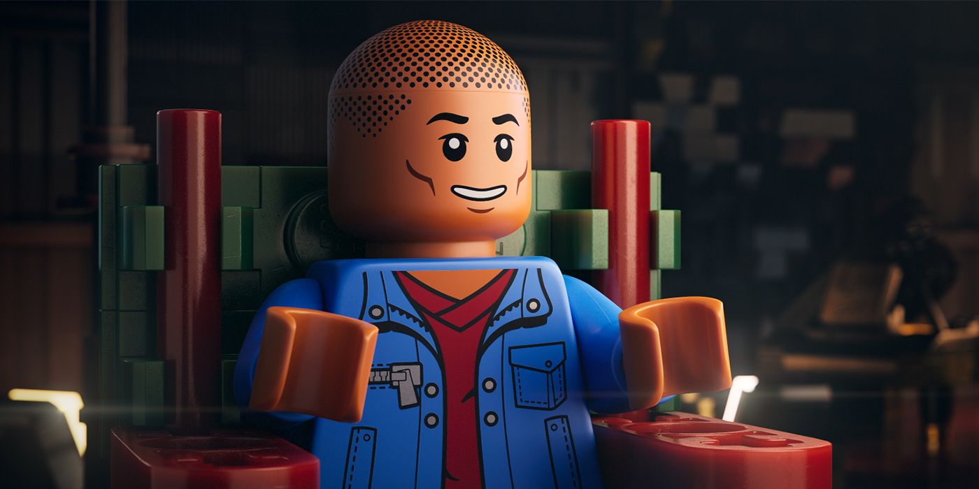 Lego Pharrell Williams sitting in a chair smiling in Piece by Piece