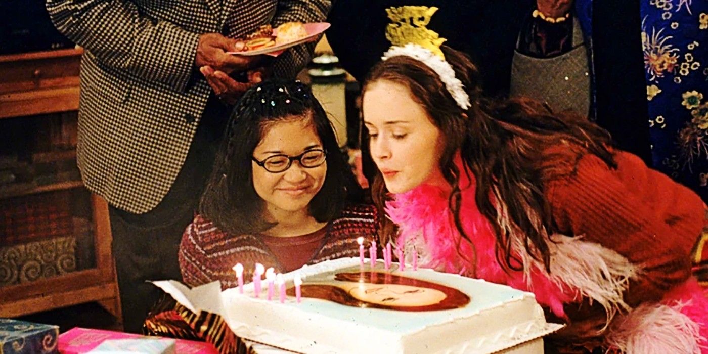 Lane Kim and Rory Gilmore blowing out the candles on Rory's Birthday cake in Gilmore Girls Season 1