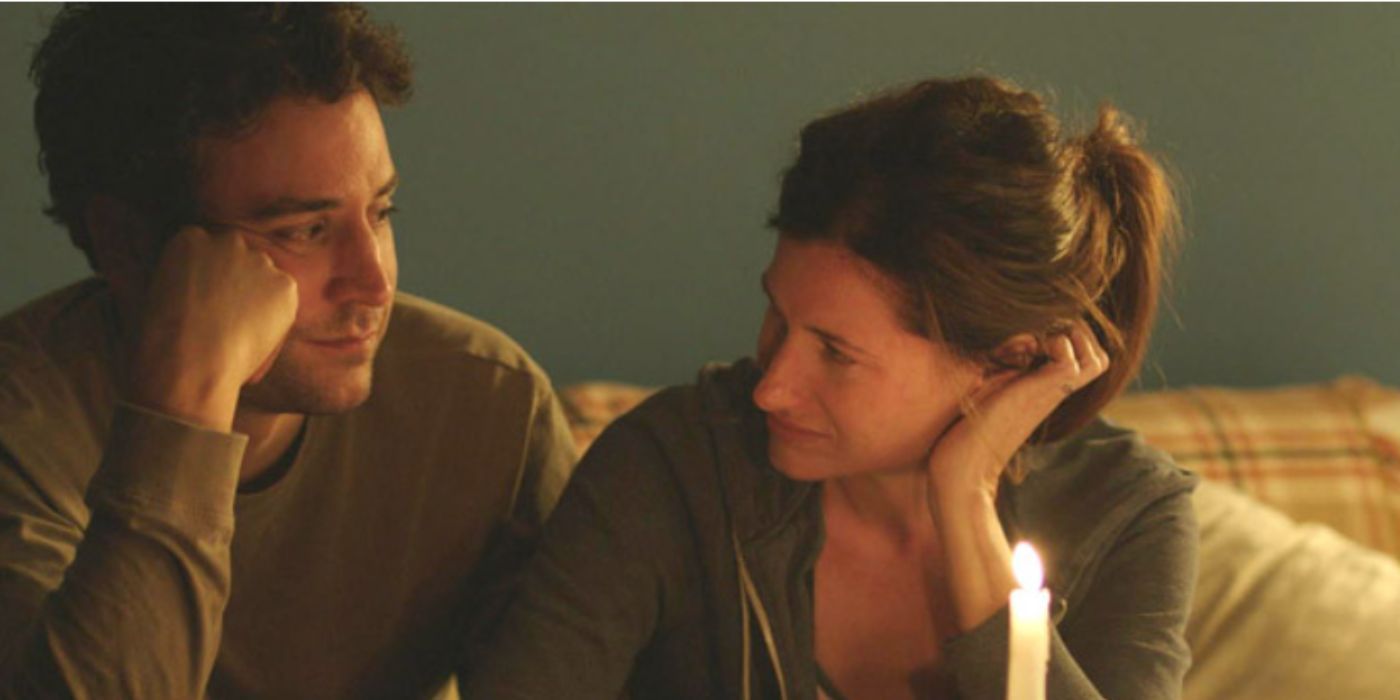 Josh Radnor and Kathryn Hahn as Jeff and Rachel lighting candles and staring at each other in 'Afternoon Delight'