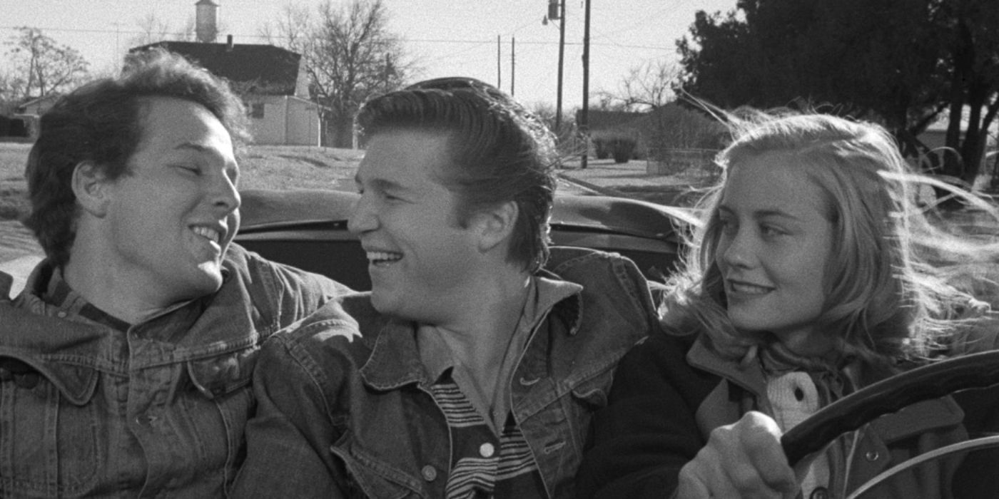 Timothy Bottoms, Jeff Bridges, and Cybill Shepherd as Sonny, Duane, and Jacy smiling driving in the car in 'The Last Picture Show'