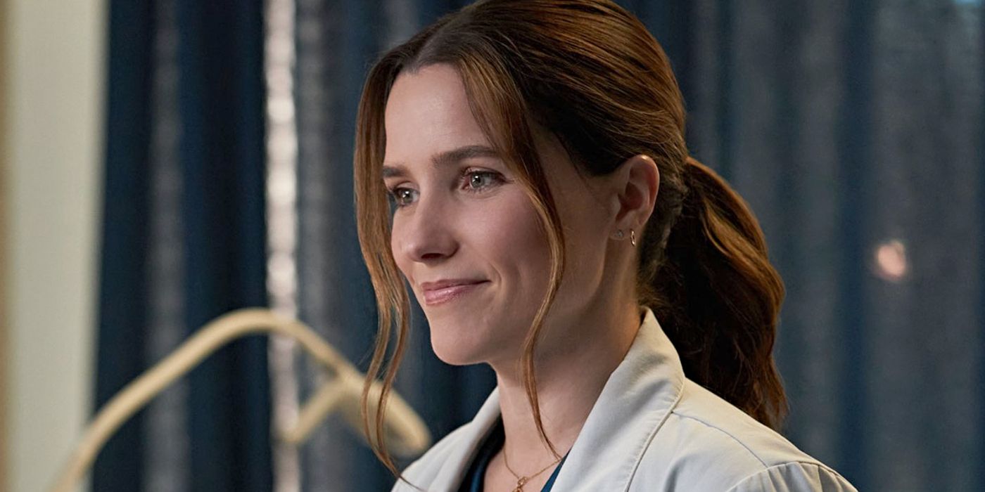 Close-up of Sophia Bush as Dr. Sam Griffith, smiling and wearing a lab coat in Good Sam