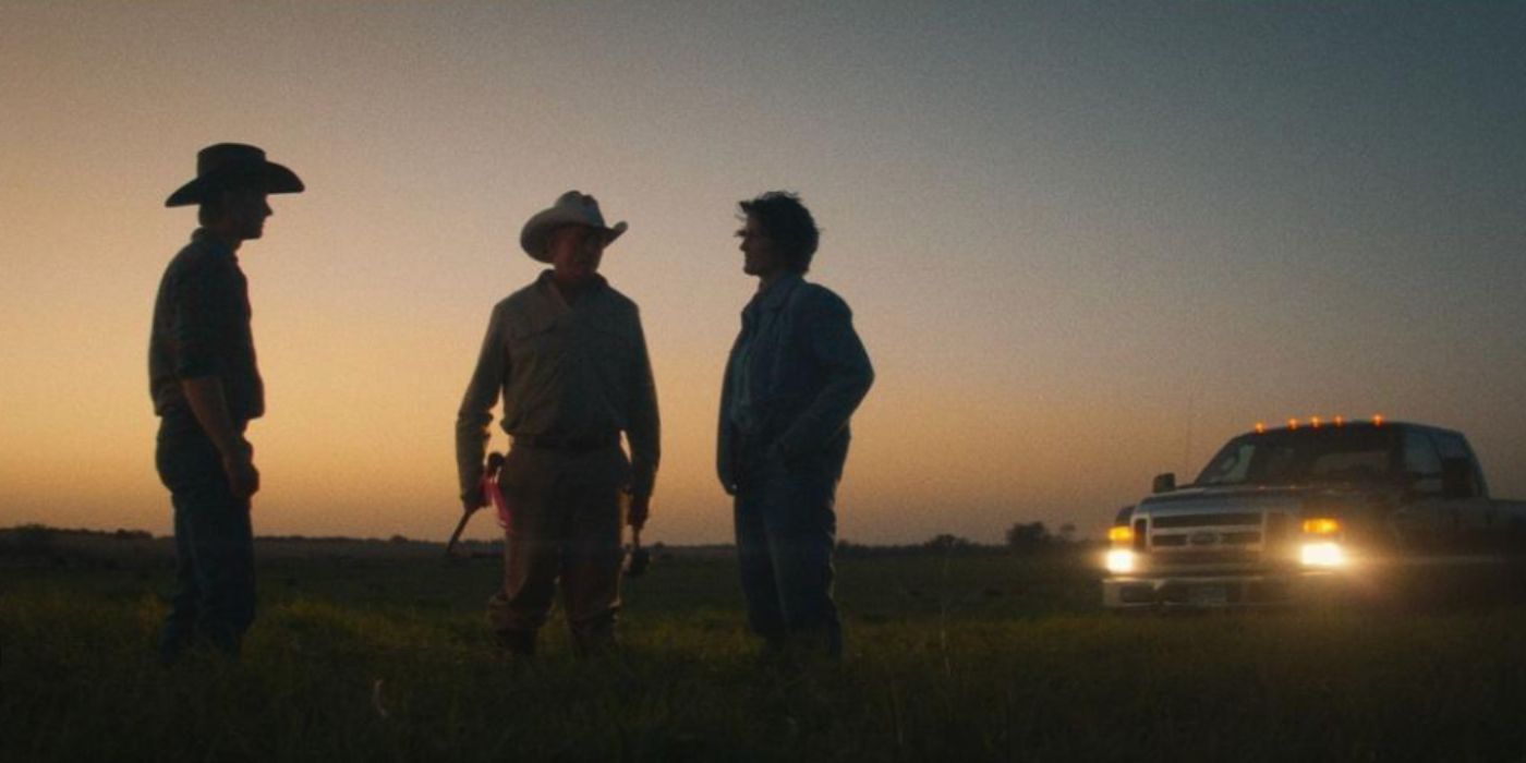 Rudy Pankow and Thomas Haden Church as Erwin and Merle standing in cowboy hats during sunset in a field in 'Accidental Texan'