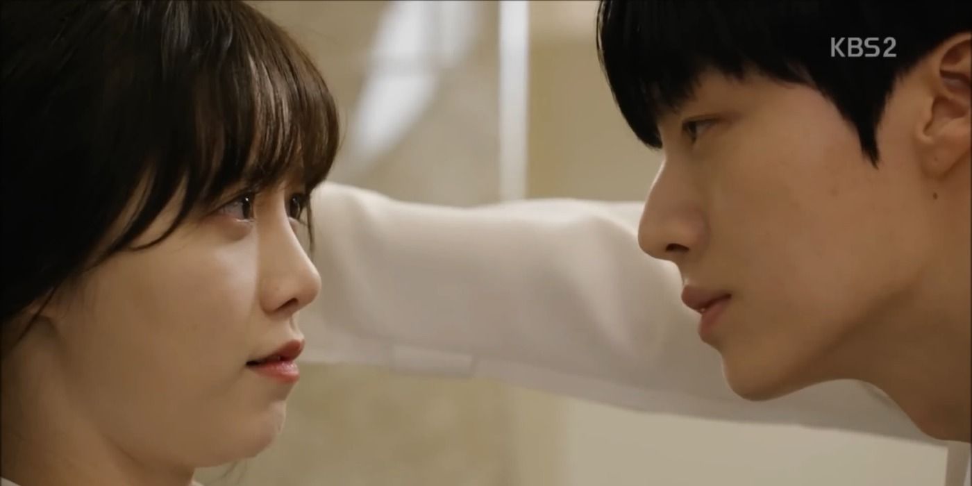 Park Jisang has Yoo Ri-Ta blocked against a wall as they have an important conversation, both of them longingly staring into each other&rsquo;s eyes, in the K-Drama &ldquo;Blood.&quot;