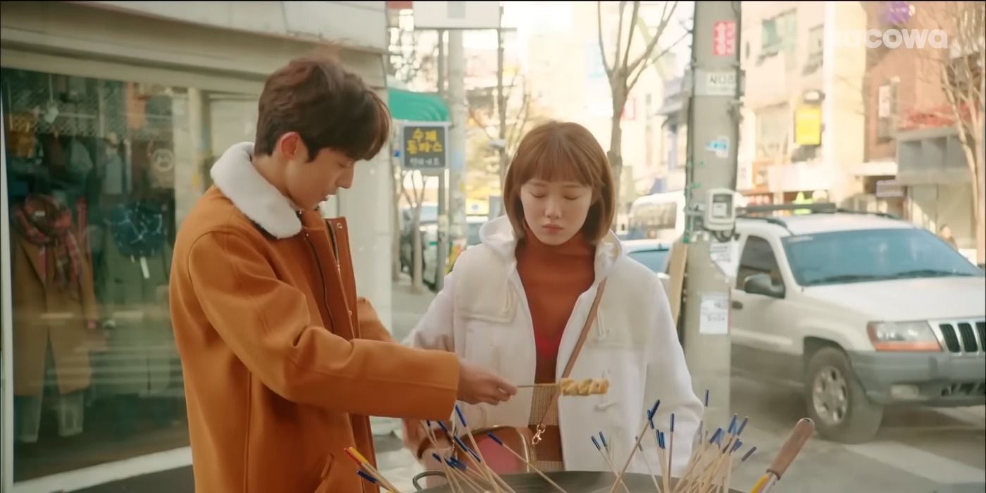 Kim Bok Joo & Jung Joon Hyung looking interested in street food in Weightlifting Fairy Kim Bok Joo.