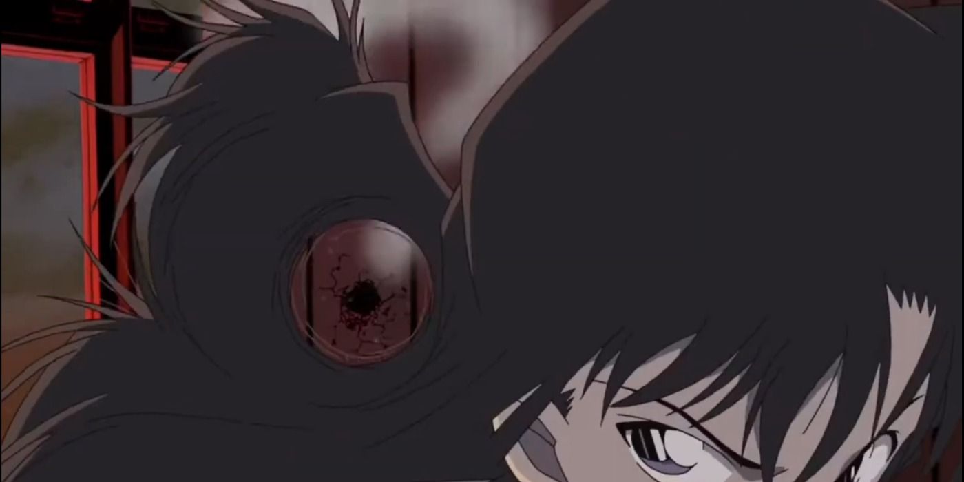 Ran Mouri dodges a bullet in Detective Conan movie 13, looking concentrated & ready to take down a criminal.