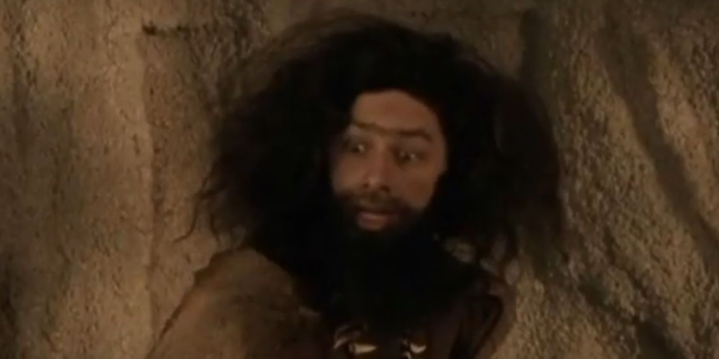 JD dressed as a caveman looks panicked in Scrubs.