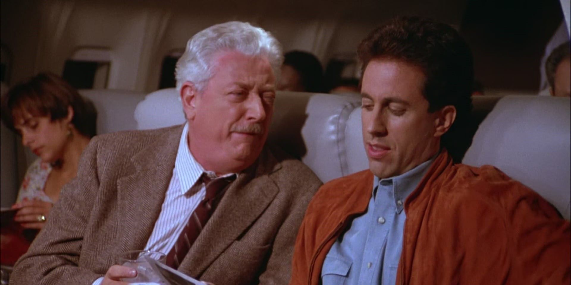 Jerry-Seinfeld-sitting-next-to-an-old-intoxicated-man-on-a-plane