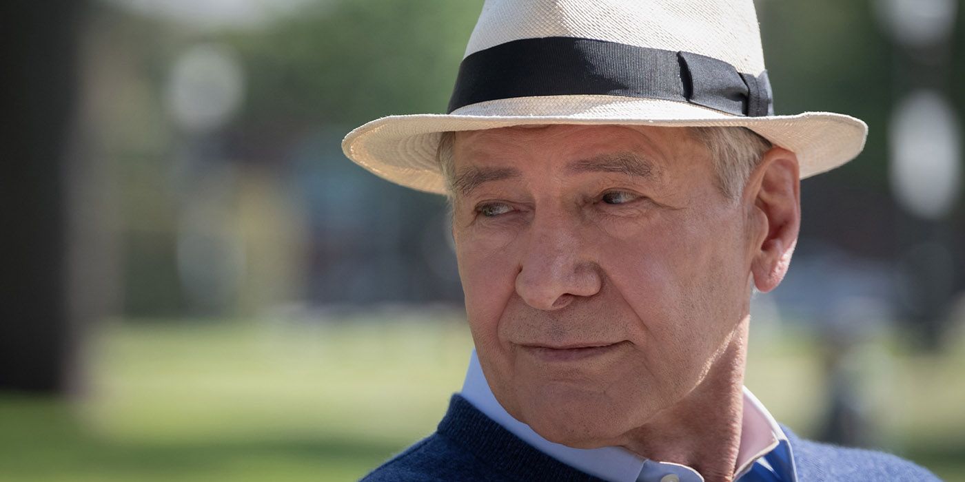 Close-up still of Harrison Ford as Paul in Shrinking sitting with a hat on smiling