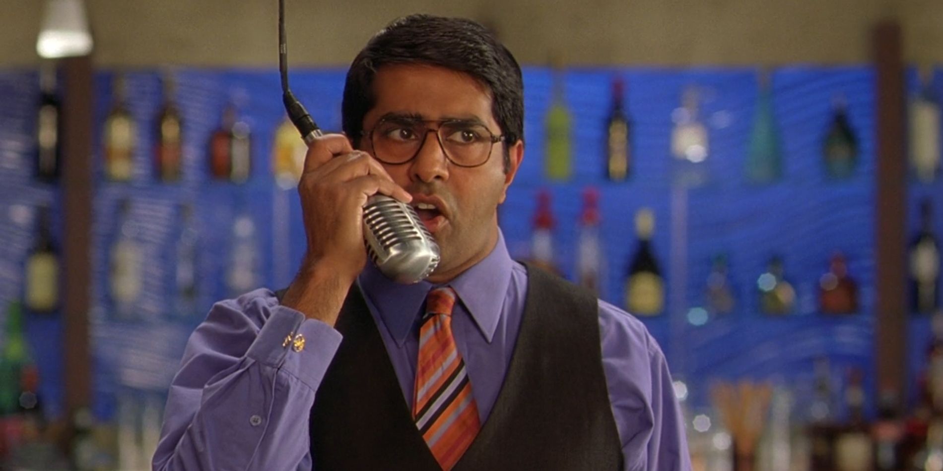 Restaurant waiter Nuts holds a hanging microphone in &lsquo;The Slammin&rsquo; Salmon&rsquo;.