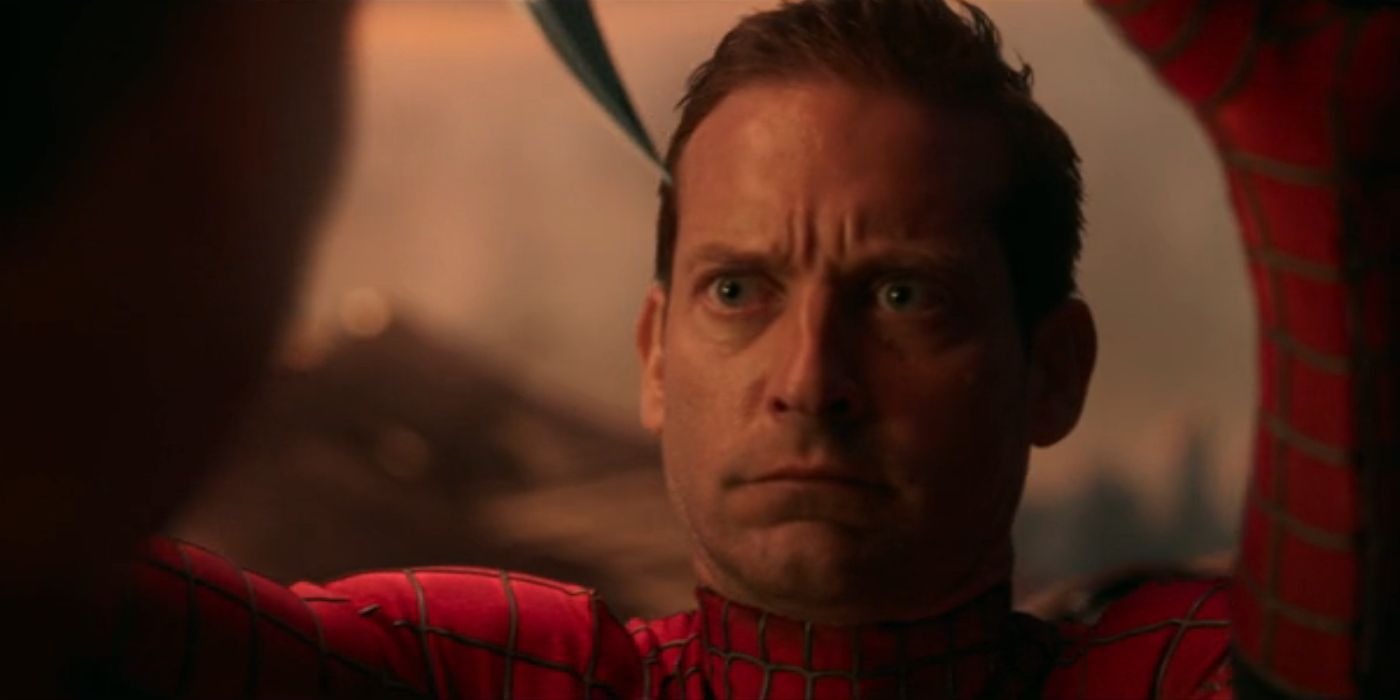 Tobey Maguire's Peter Parker blocks a sharp object from coming down in 'Spider-Man: No Way Home'.