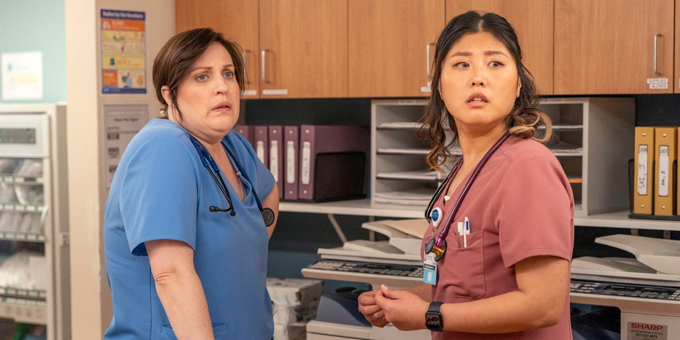 Alex (Allison Tolman) and Serena (Kahyun Kim) standing net to each other near a cabinet and looking offscreen toward the right in St. Denis Medical