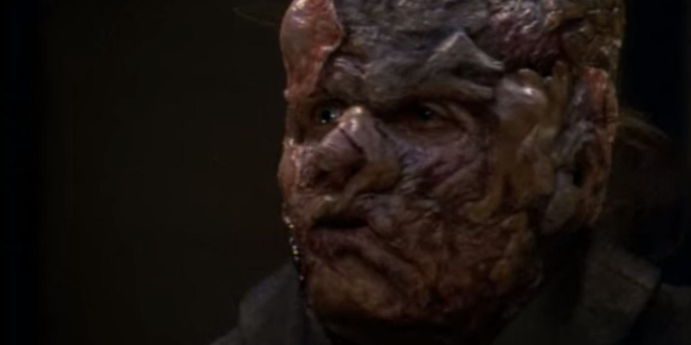 In Star Trek: Voyager, a scary-looking alien looks away from the camera.