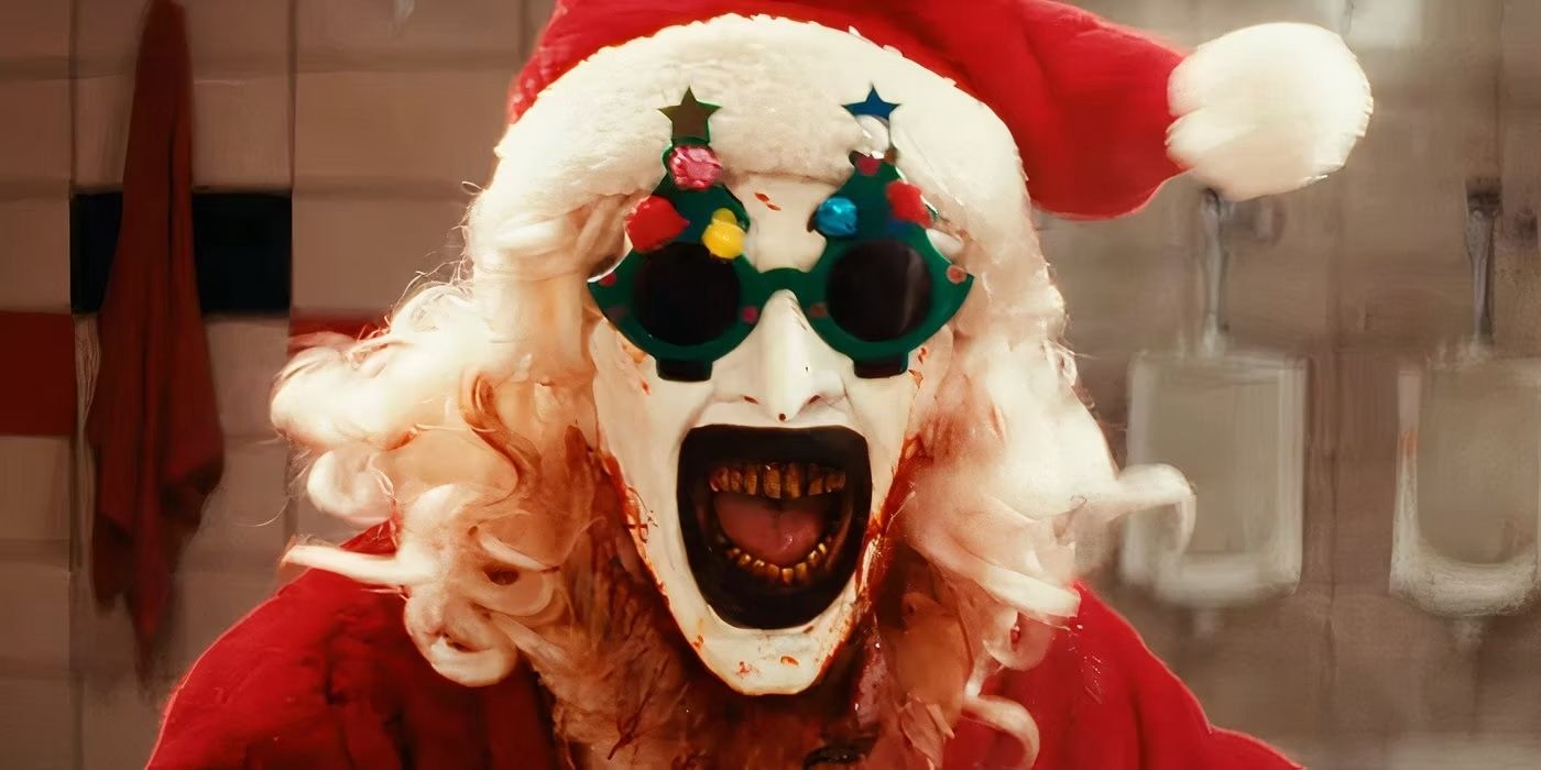 David Howard Thornton as Art the Clown wearing a Santa suit and laughing in Terrifier 3