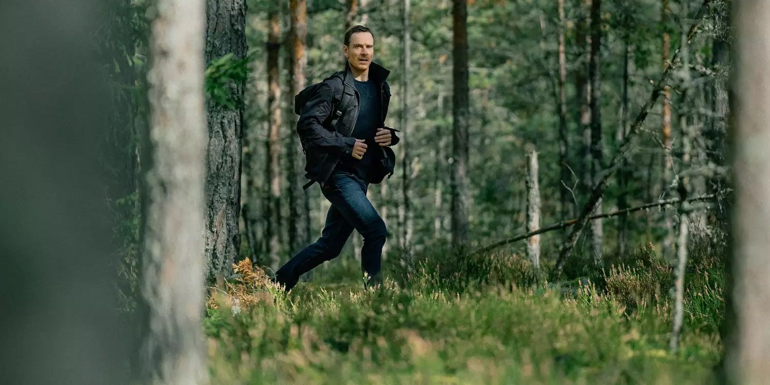 Michael Fassbender as Martian running in the woods in The Agency