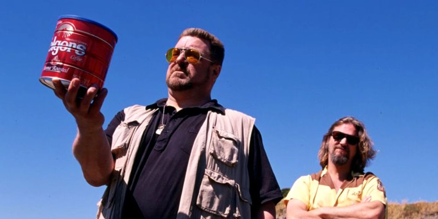 Walter Sobchak (John Goodman) holds up a tin containing his friend's ashes as the Dude (Jeff Bridges) stands unamused behind him in 'The Big Lebowski' (1998).