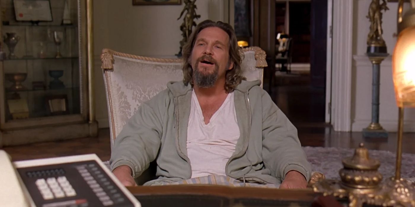 The Dude (Jeff Bridges) sits in a table in a lavish office in 'The Big Lebowski' (1998).