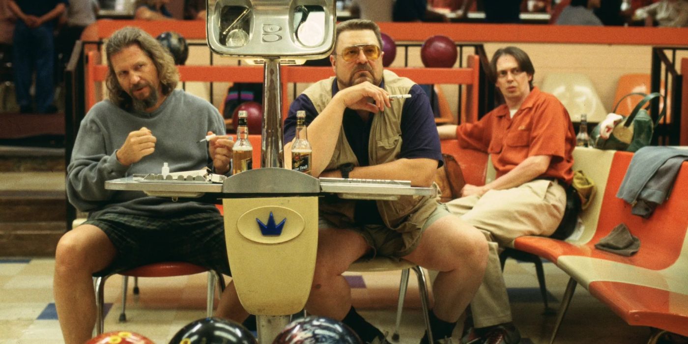 The Dude (Jeff Bridges) and Walter (John Goodman) sit behind a petition in the bowling alley while Donny (Steve Buscemi) sits behind them in &lsquo;The Big Lebowski&rsquo; (1998).