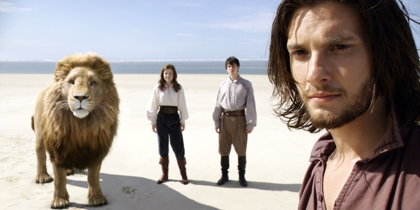 Aslan, Lucy, Edmund, and King Caspian stand on the shores that border Aslan&rsquo;s Country