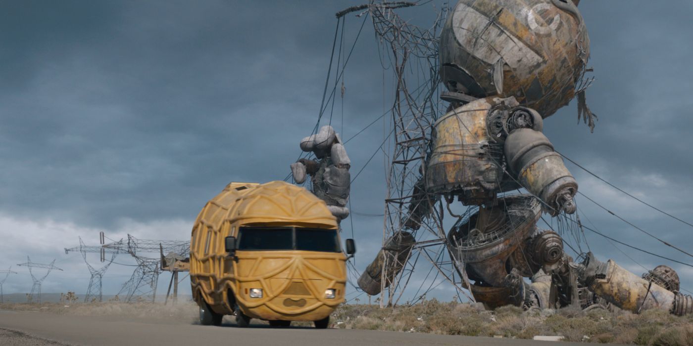 The PeanutMobile driving past a giant decaying robot in The Electric State.