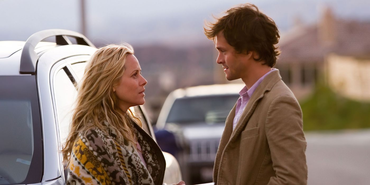 Jocelyn (Maria Bello) &amp; Grigg (Hugh Dancy) stand and face each other in The Jane Austen Book Club.