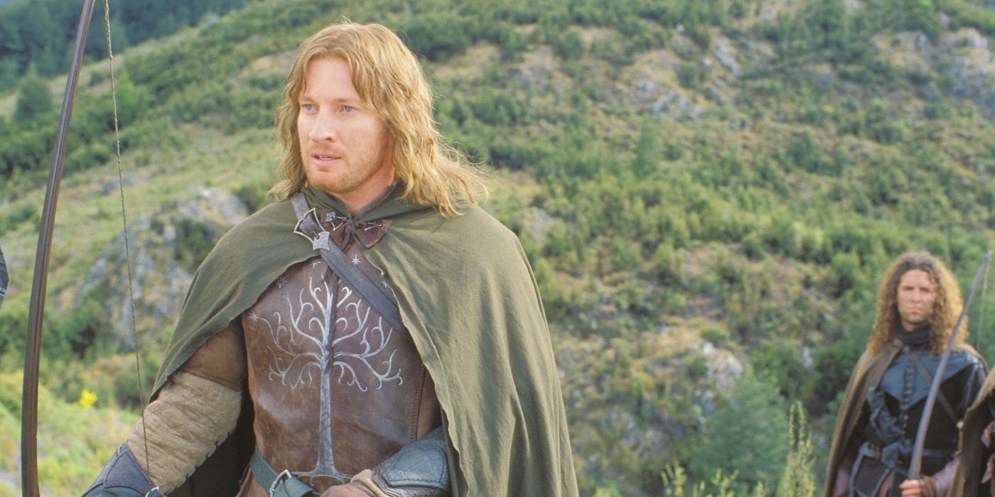 Faramir (David Wenham) standing against a forest background, holding a bow and arrow, and looking offscreen to the left in The Lord of the Rings: The Two Towers