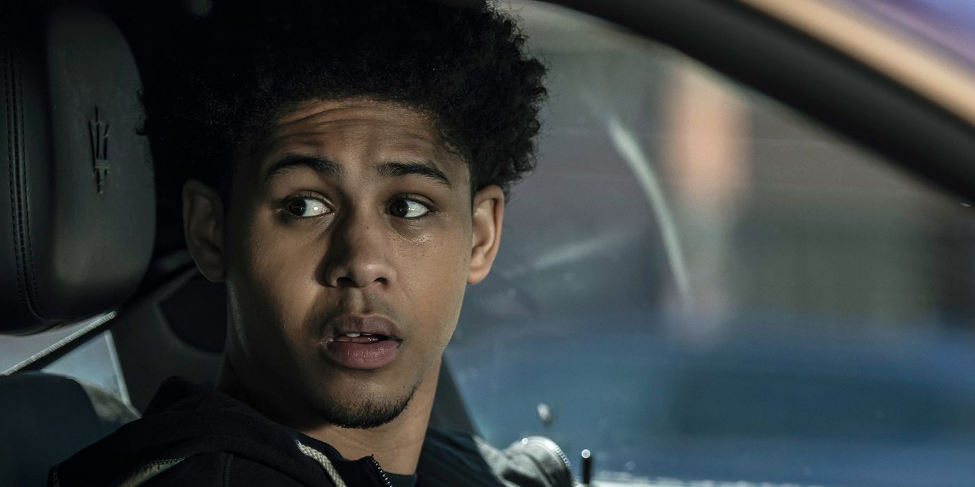 Rhenzy Feliz as Victor in the driver's seat looking over at someone with a surprised expression in The Penguin