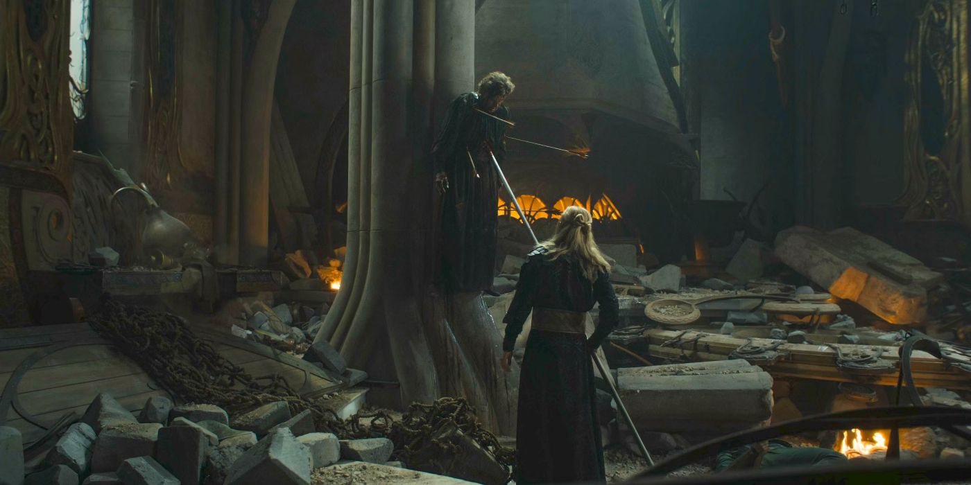 Sauron (Charlie Vickers) stabbing Celebrimbor (Charles Edwards) onto a spear and hoisting him off the ground against a tall pillar in The Rings of Power Season 2 finale